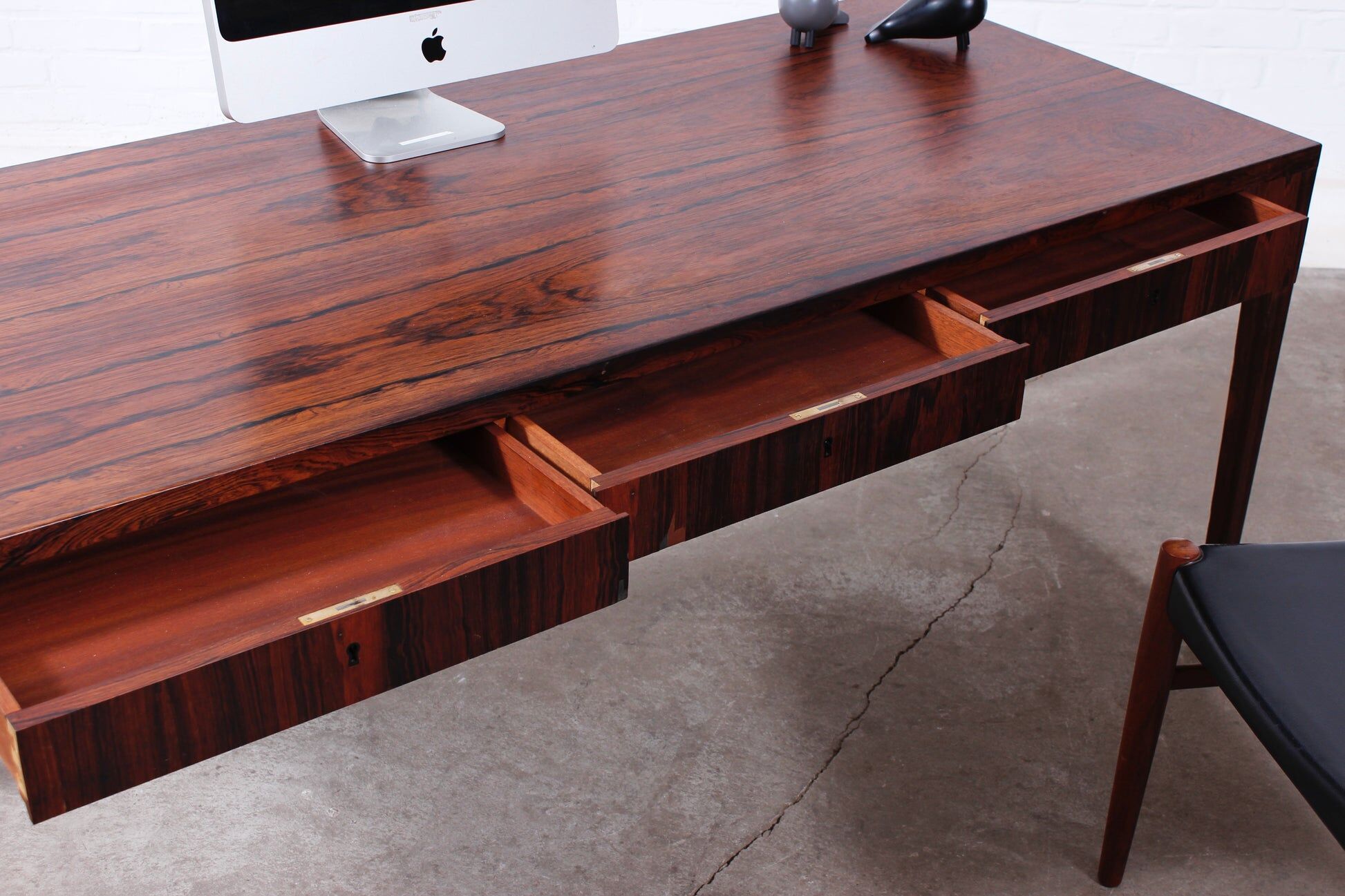 Minimalist rosewood desk by Riis Andersen