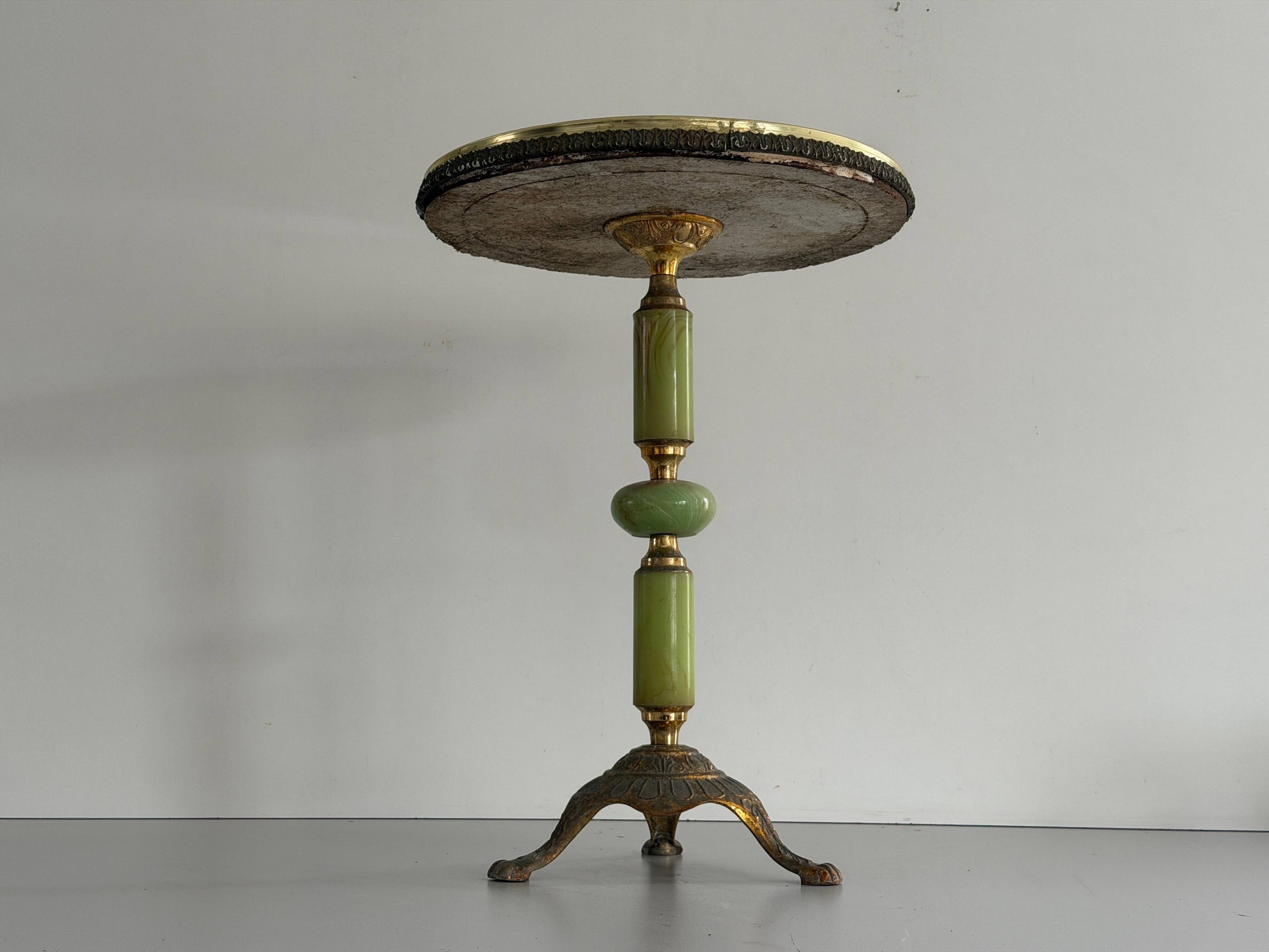 Mid-century side table in green marble with a brass base, 1960s, Italy.