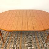 Round table with butterfly extension