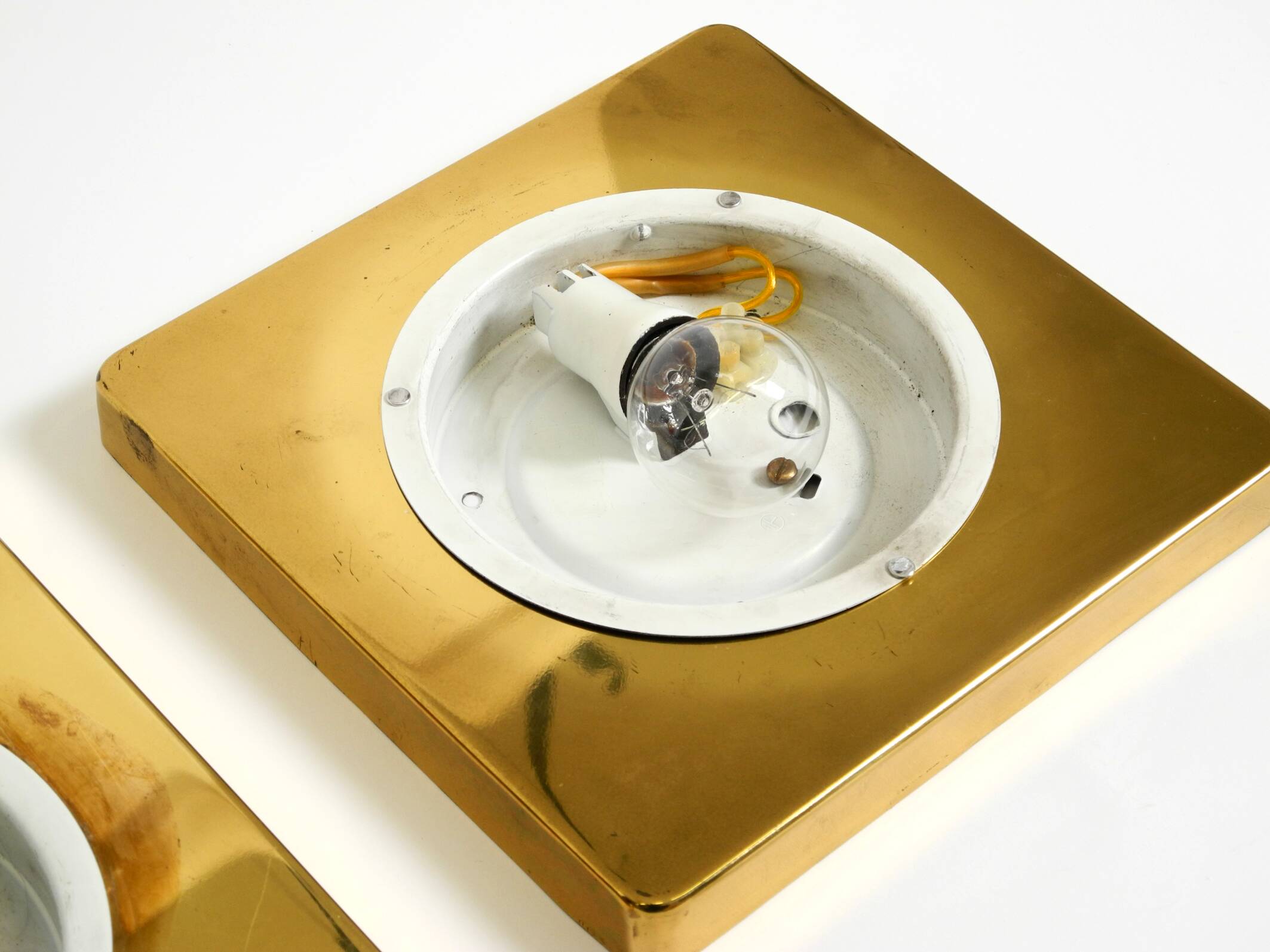 Two 1970s brass wall lamps by Rolf Krüger for Heinz Neuhaus Leuchten