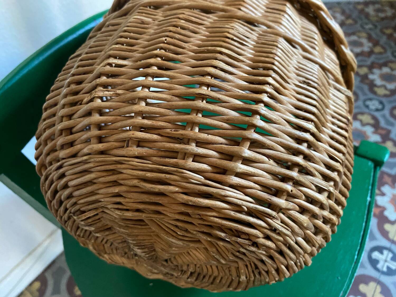 Round wicker basket in a bohemian style.