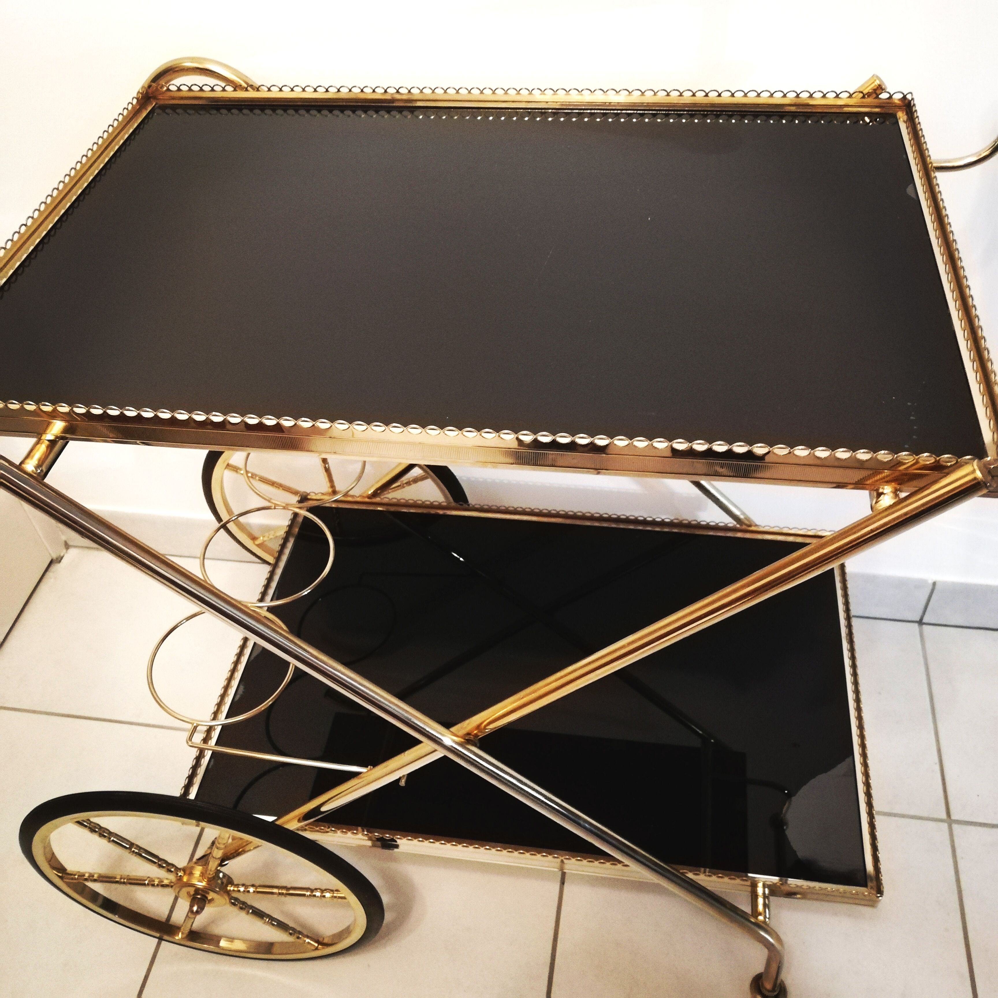 Golden brass trolley wheeled dessert and glass trays