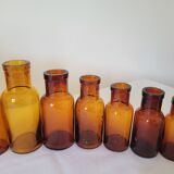 11 bottles of amber glass apothecary