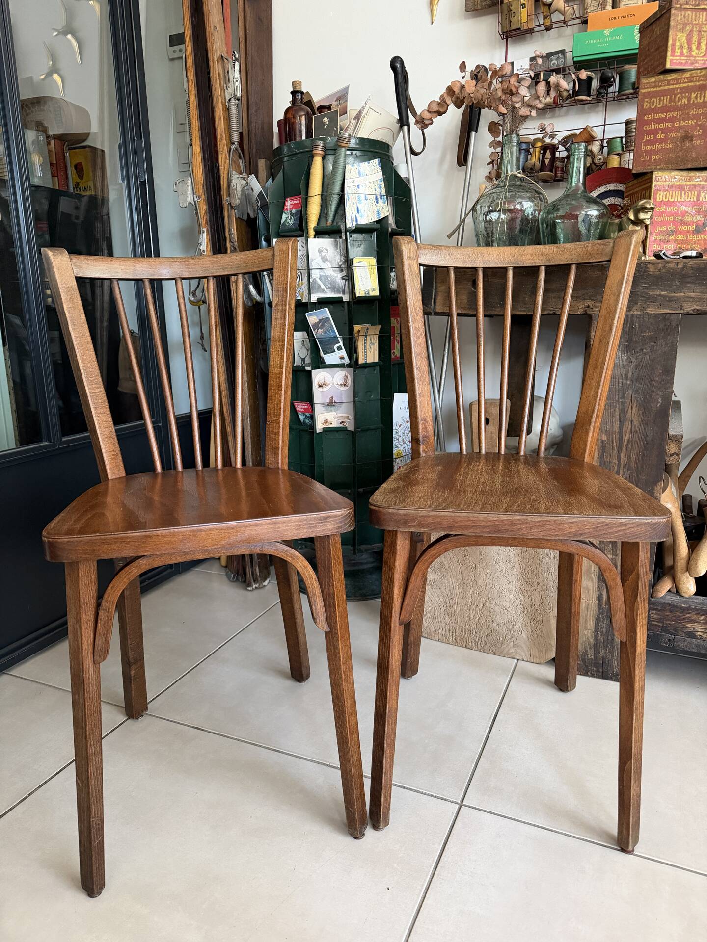 Pair of vintage Baumann bistro chairs in wood.