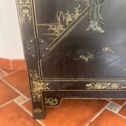Magnificent black and gold lacquered Chinese cabinet.