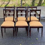 6 dining chairs made of solid mahogany in Regency style with yellow fabric.