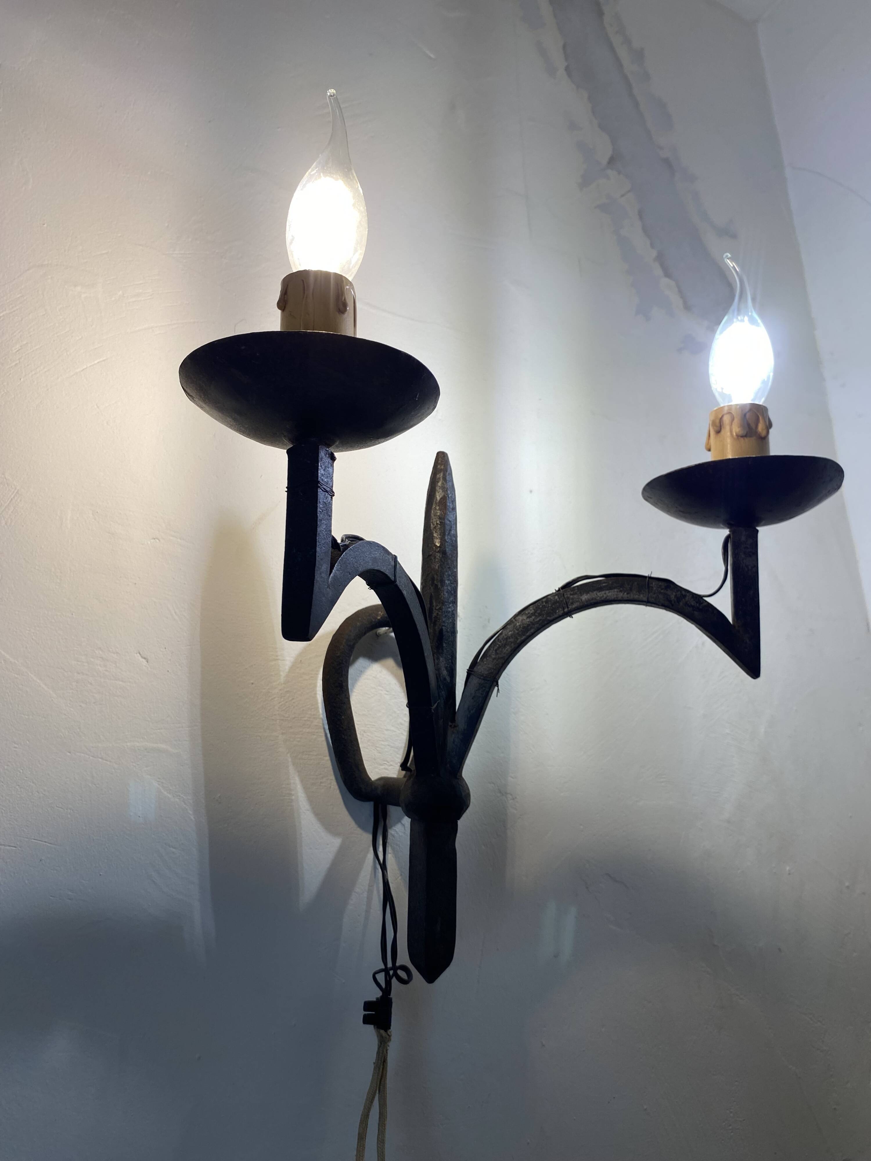 Wrought iron wall lights.