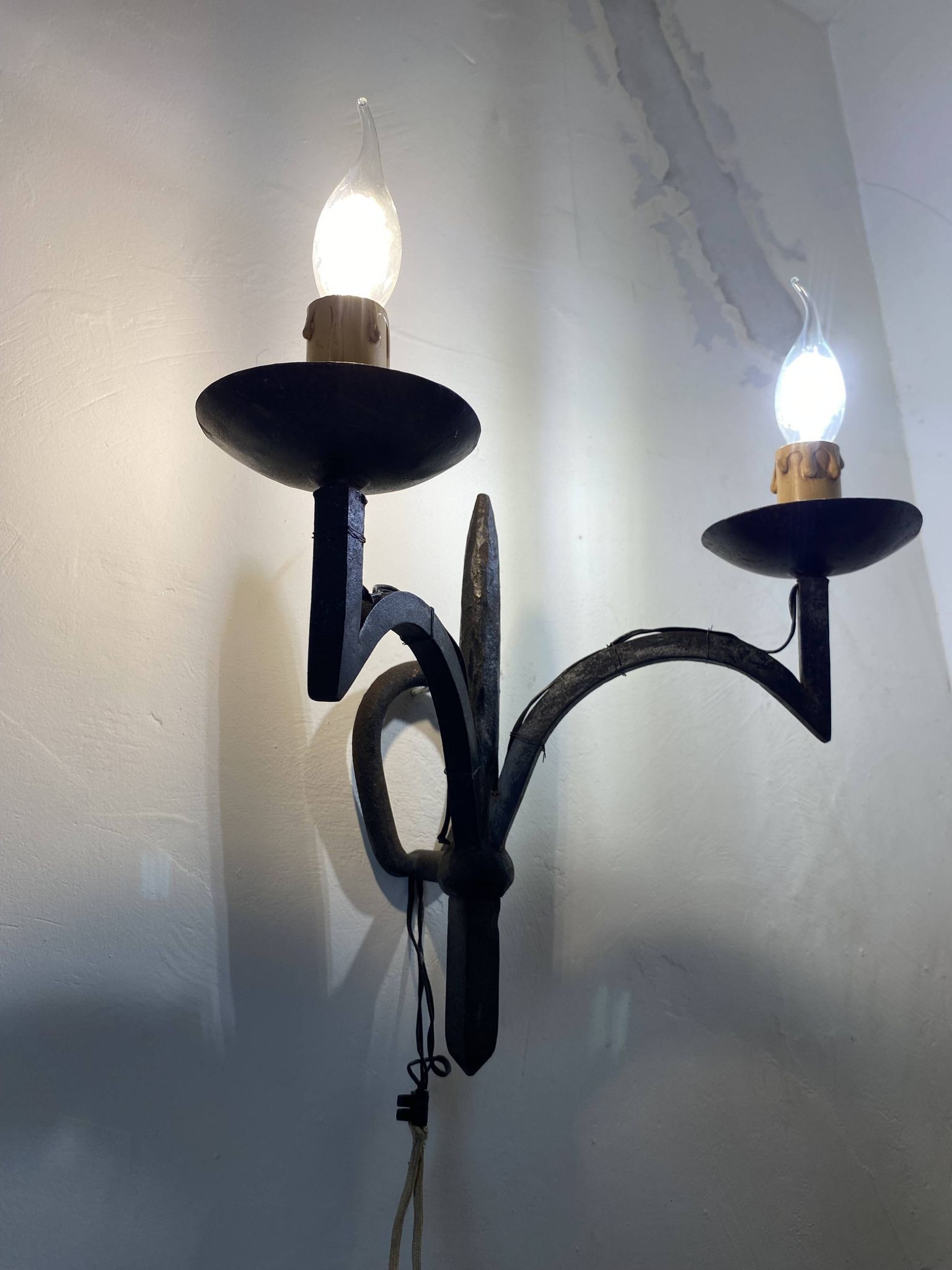 Wrought iron wall lights.