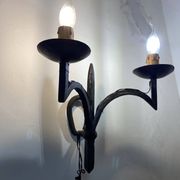 Wrought iron wall lights.