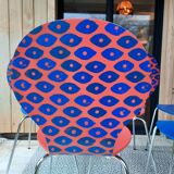 Blue and terracotta ant chairs with eye pattern