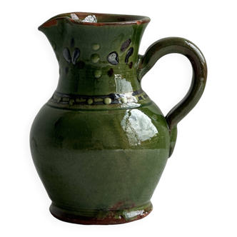 Green enameled ceramic pitcher with decorative patterns, Alsatian style.