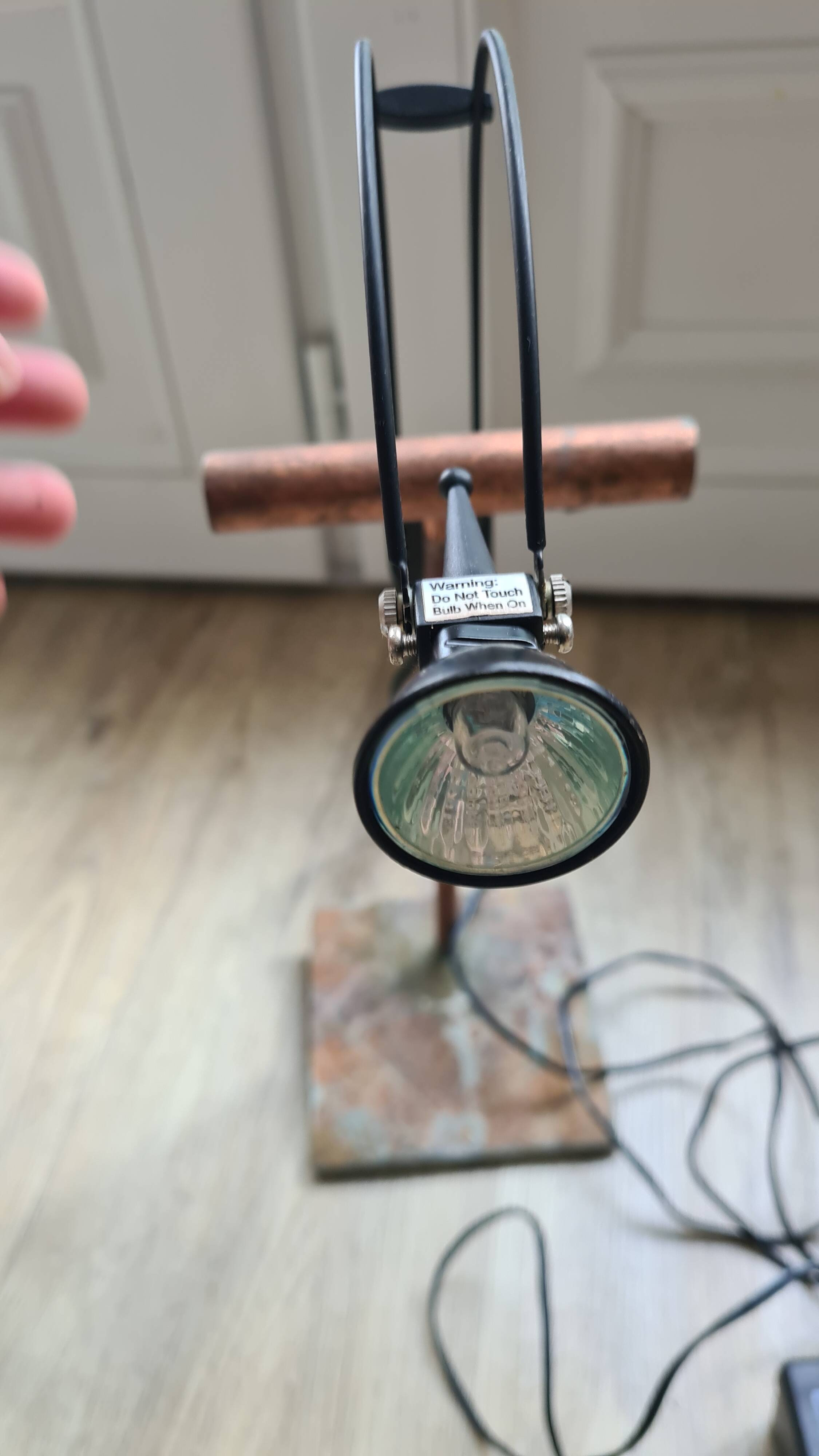 old lamp with stone base and copper arm