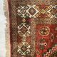 Antique wool rugs with designs on a red background, 20th century.