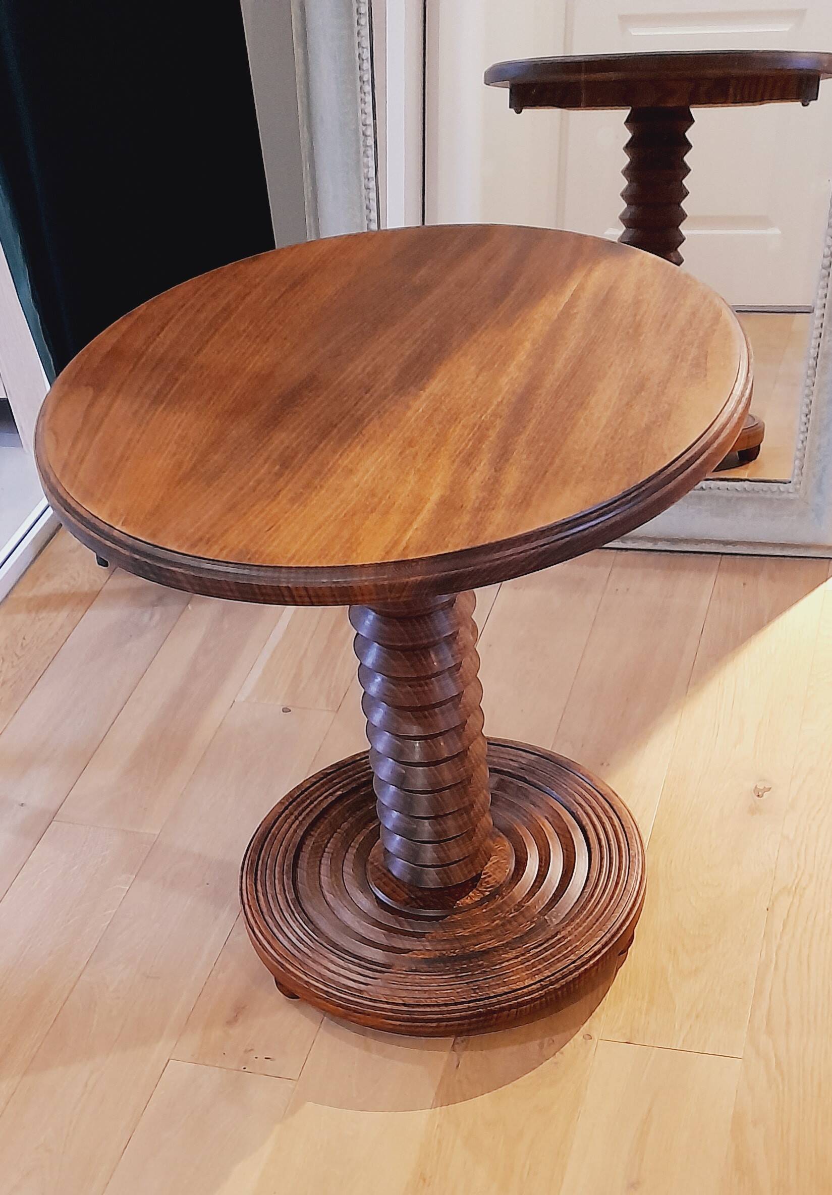 Brutalist side table with turned wood and wine press leg.