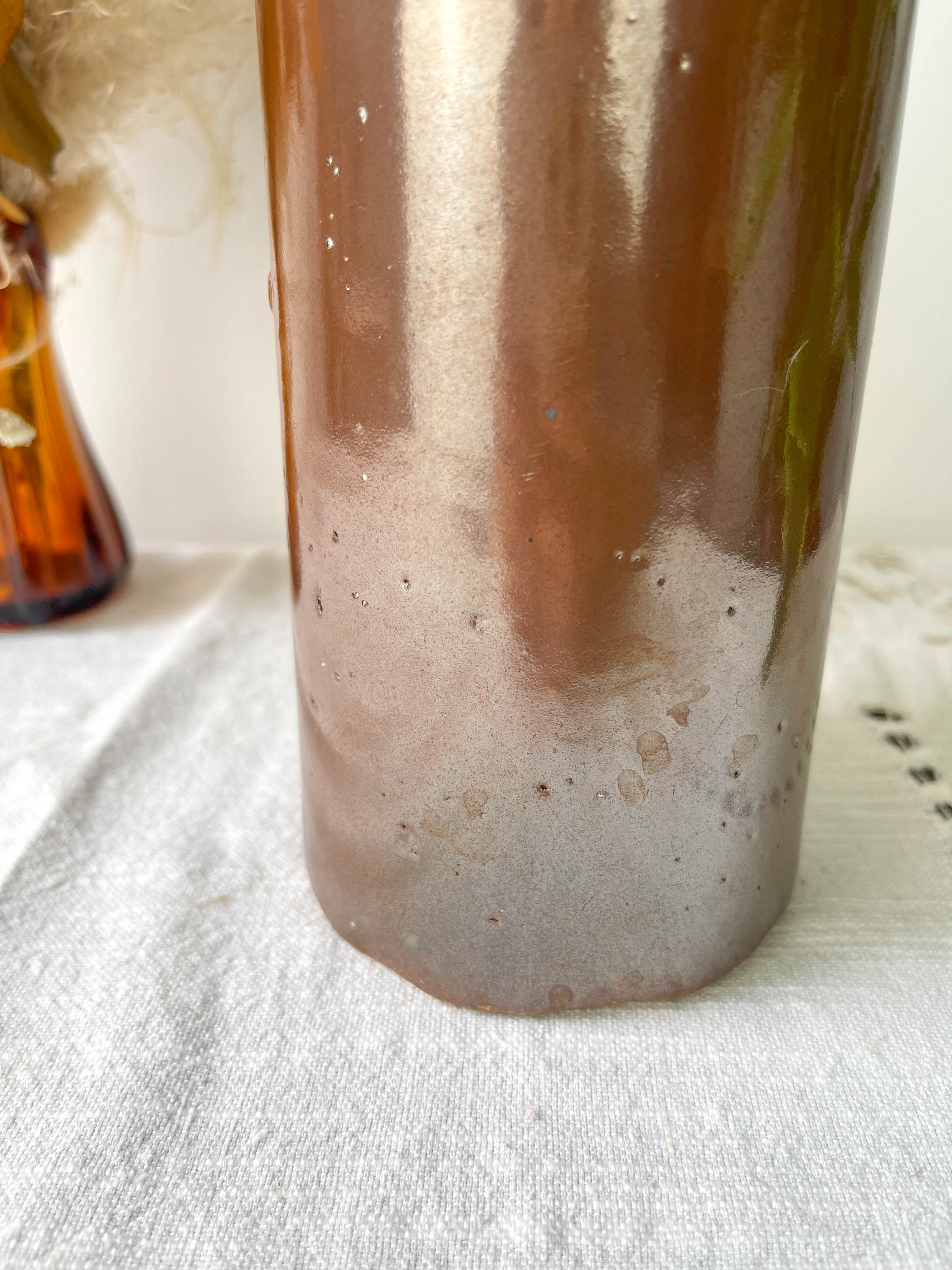 Vintage iridescent brown stoneware bottle
