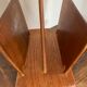 Magazine rack, in oak, by Pierre Cruège