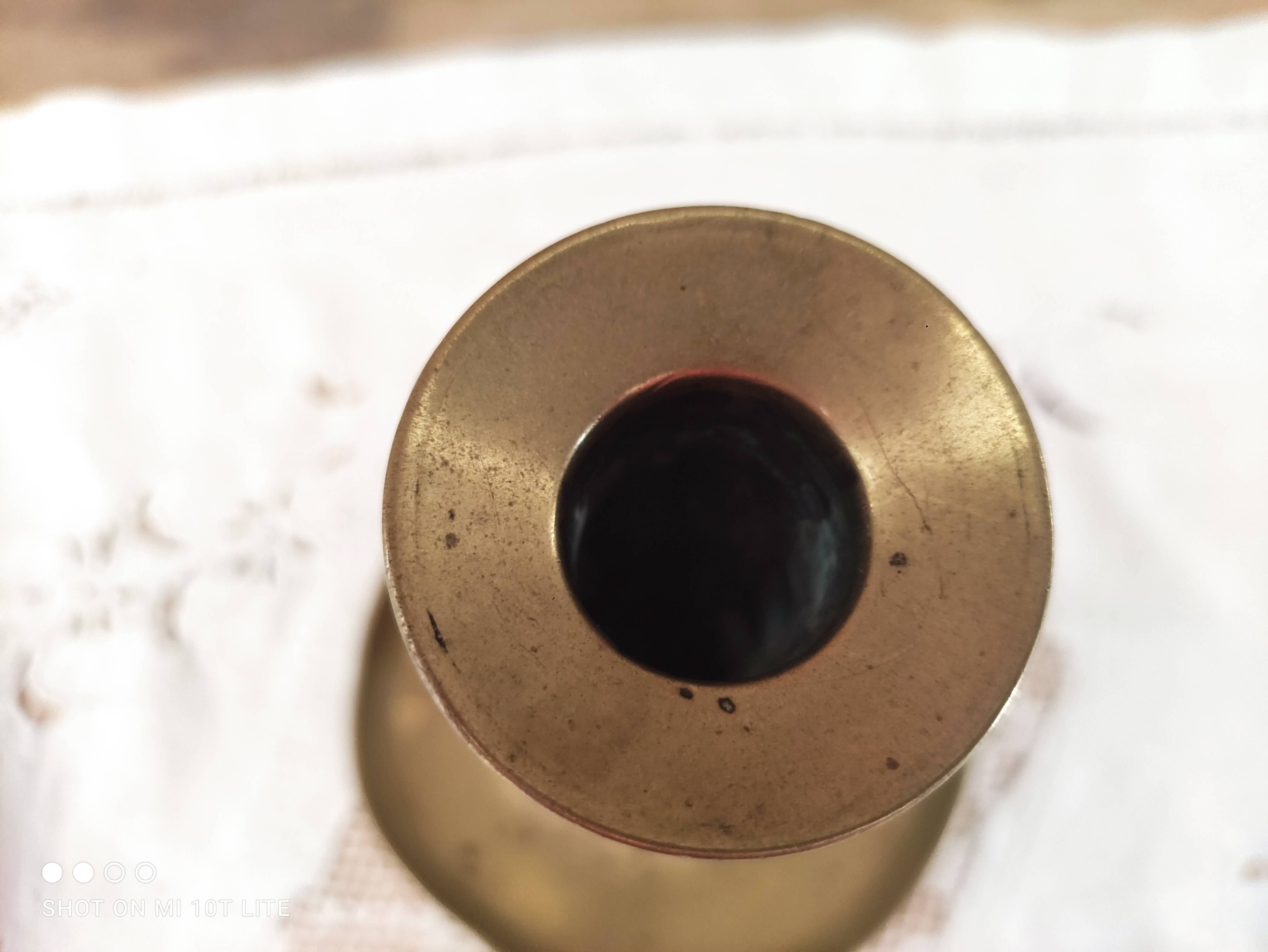 Brass push candle holder on frame