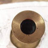 Brass push candle holder on frame