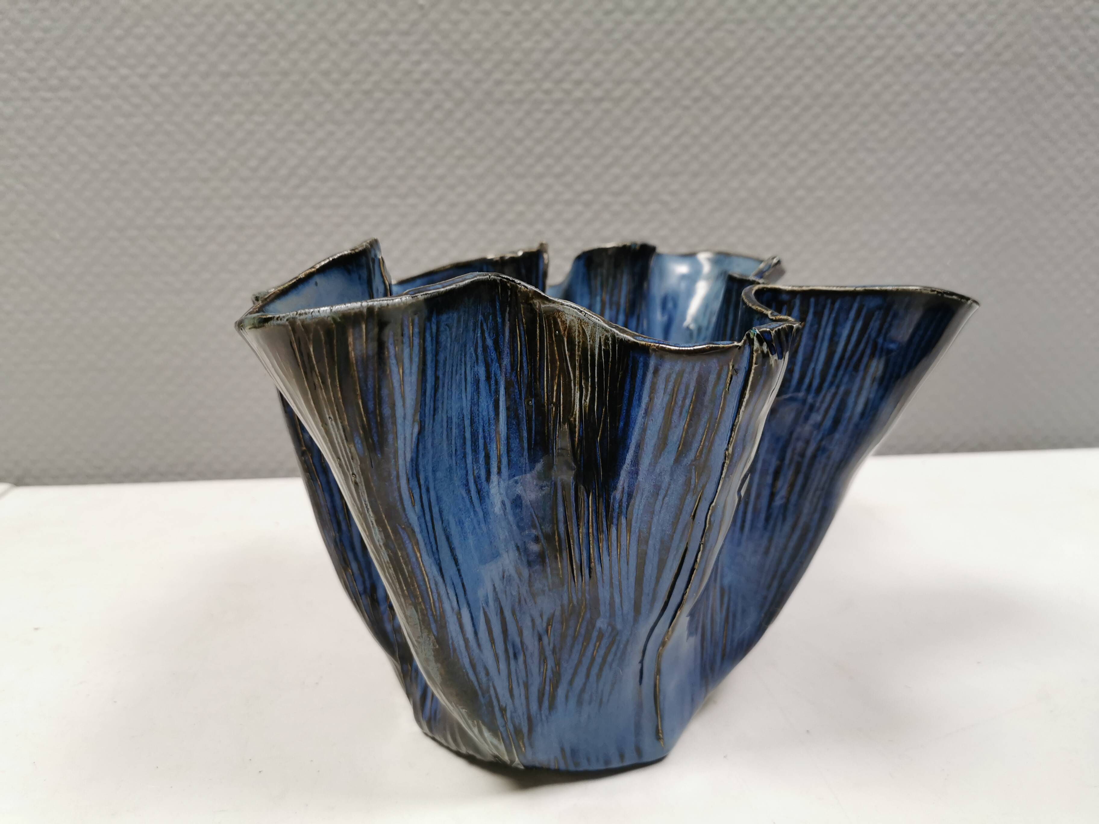 Very special vase in “folded” bluish glazed clay.