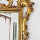 Large Italian mirror in carved wood, traditional gilding, 1980s.