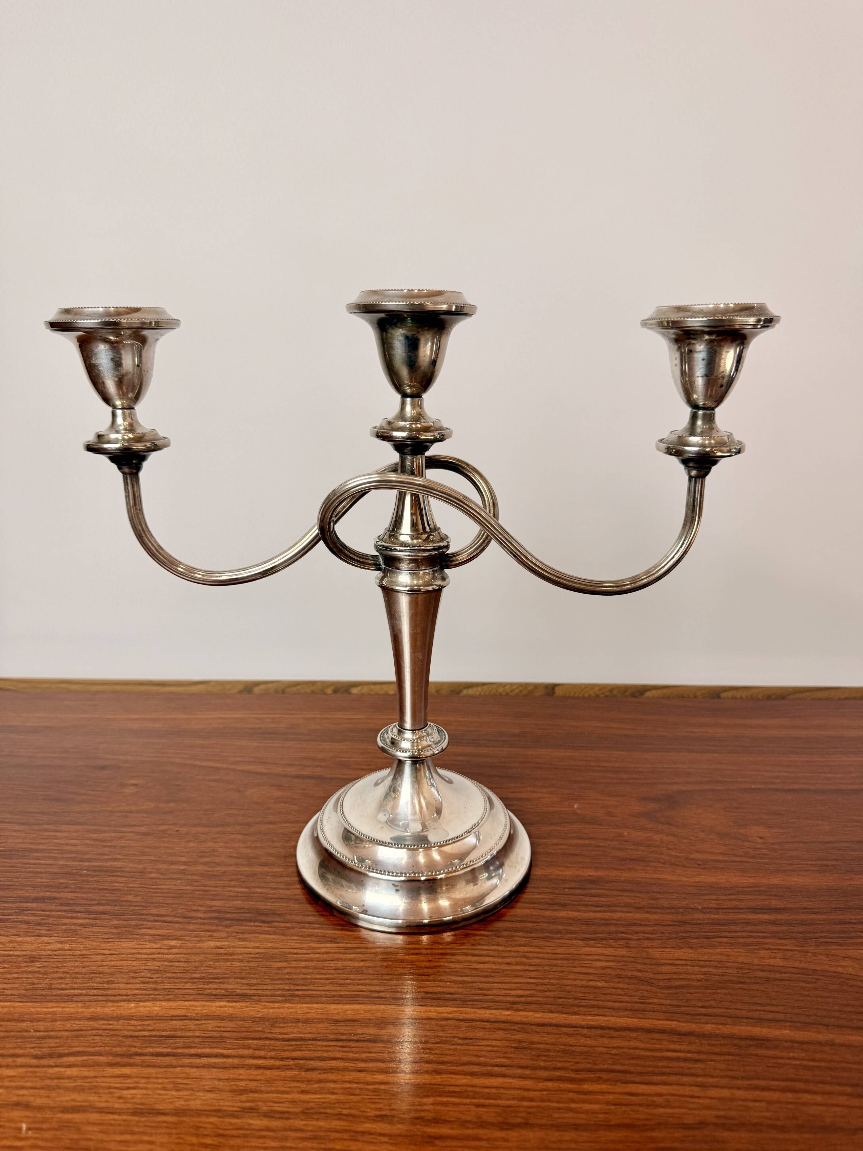 Vintage twisted chandelier with three lights in silver-plated metal.