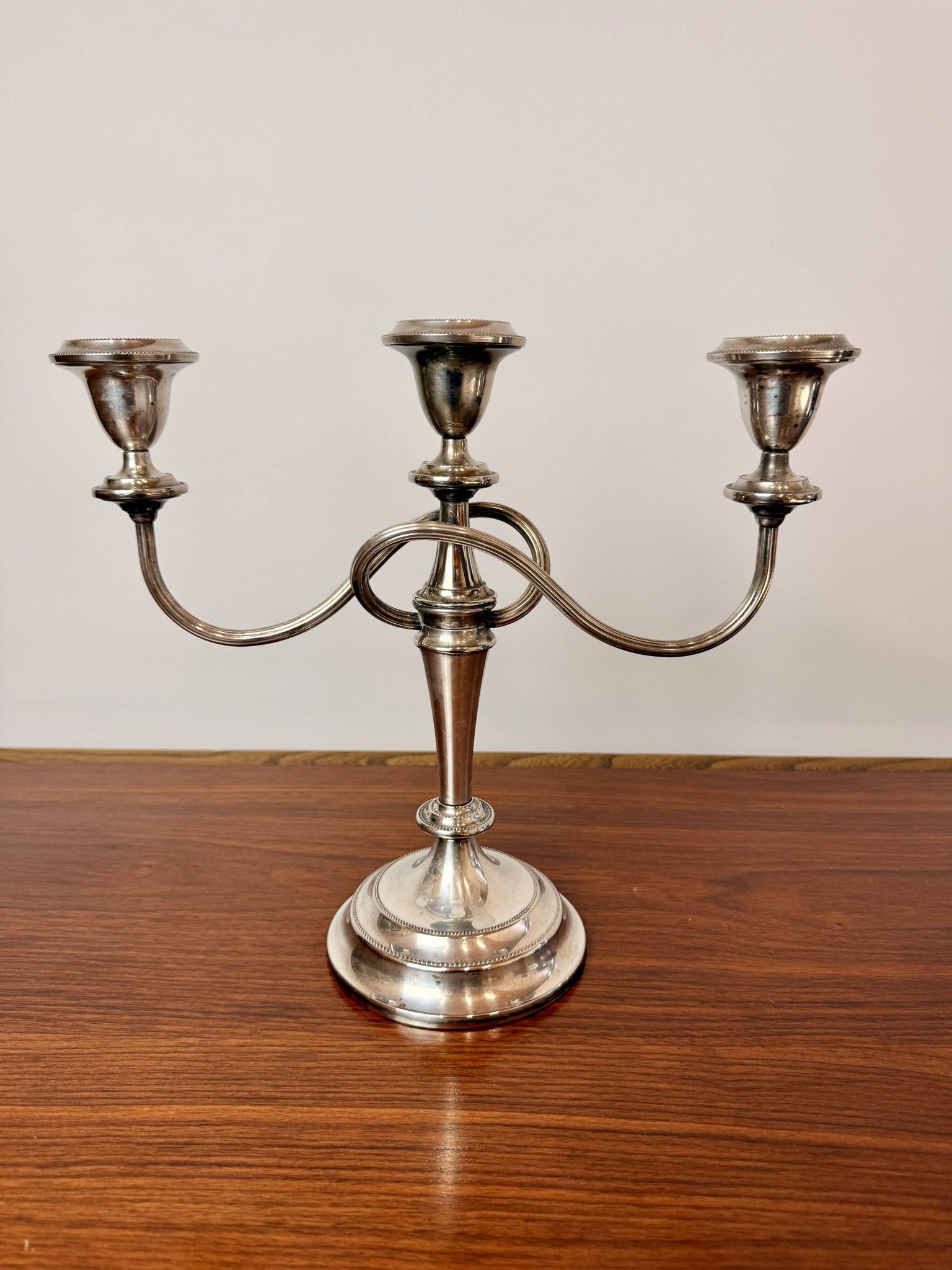 Vintage twisted chandelier with three lights in silver-plated metal.