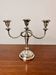Vintage twisted chandelier with three lights in silver-plated metal.