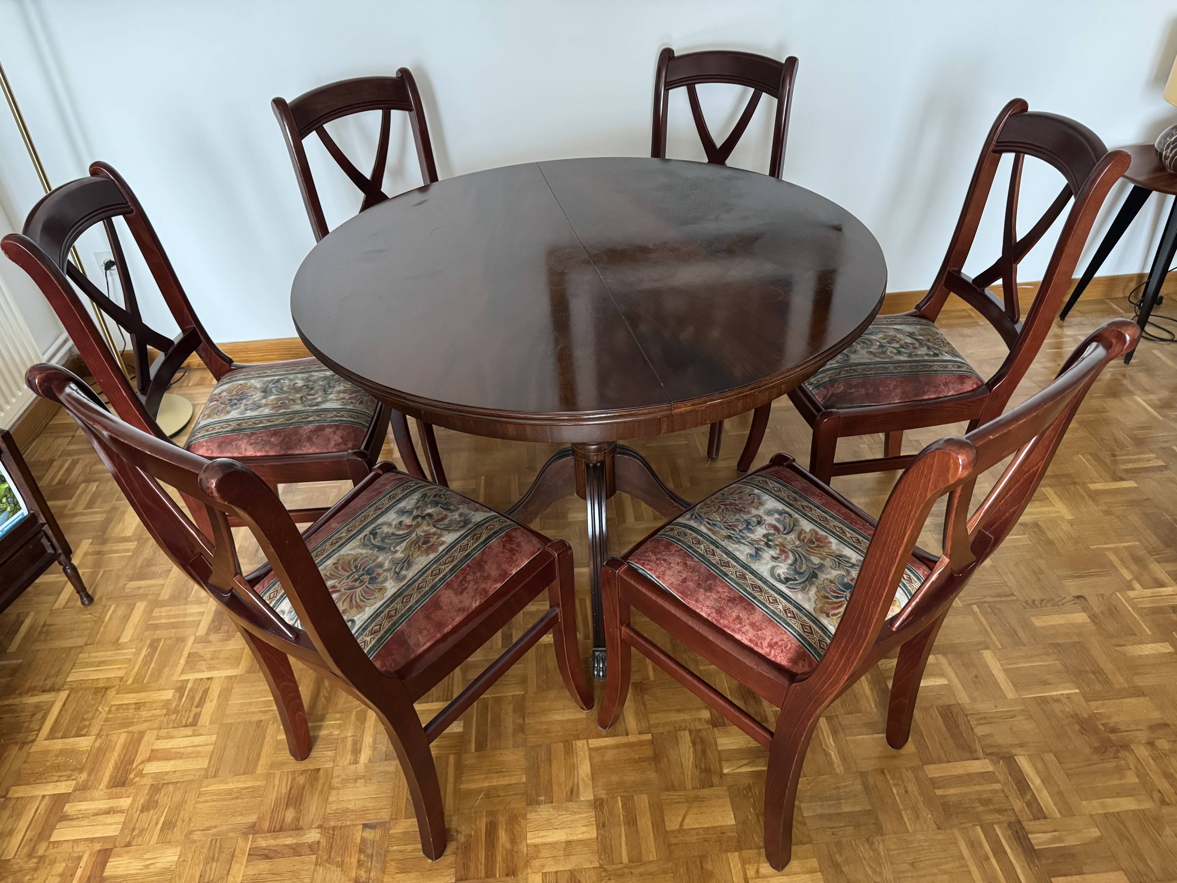 Round mahogany table and beech chairs.