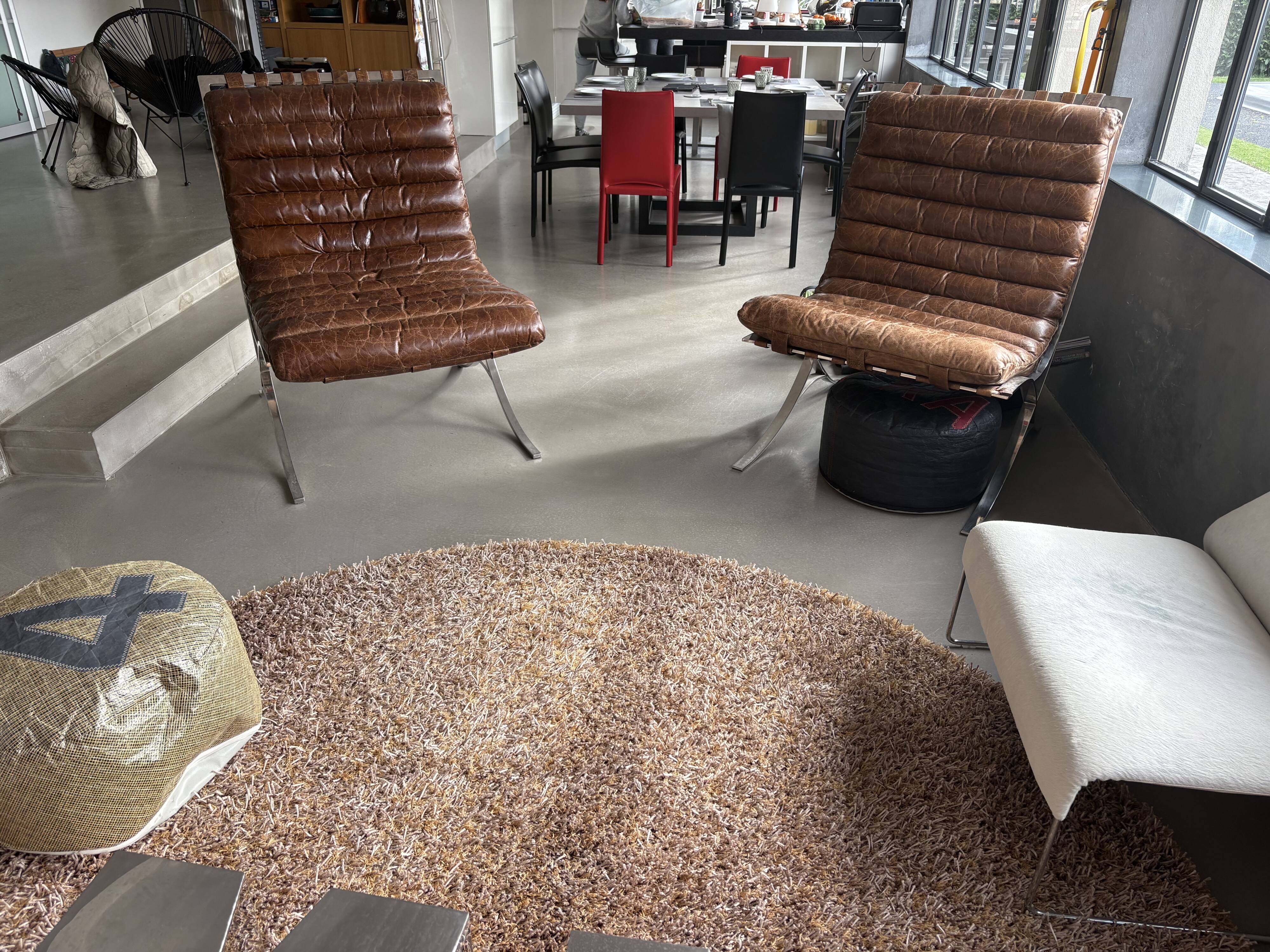 Pair of brown leather armchairs