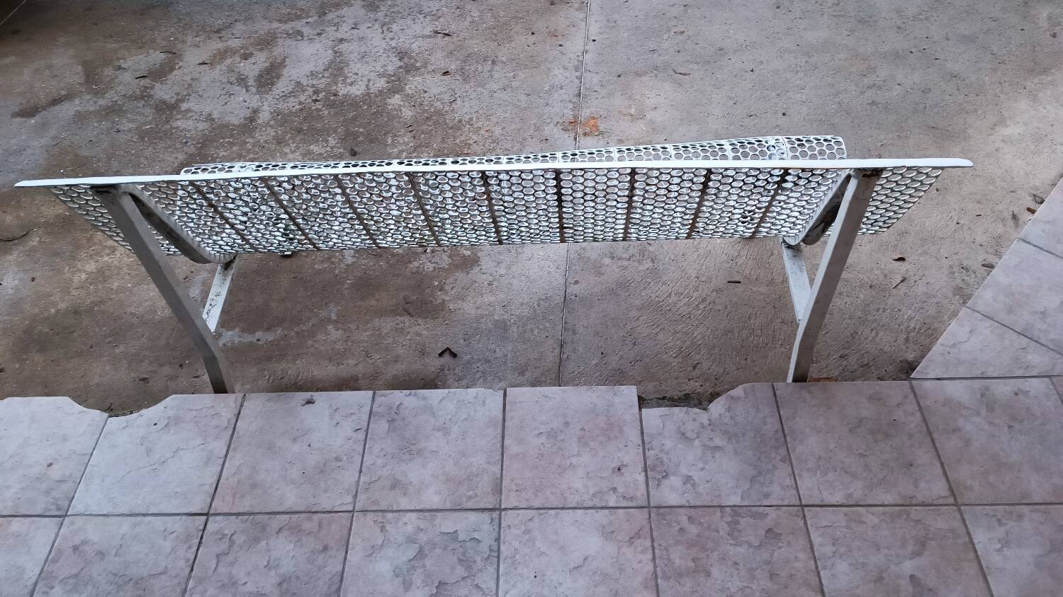 Old perforated outdoor bench