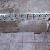 Old perforated outdoor bench
