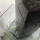 Roche Bobois console in veined black marble and glass, 1990s.