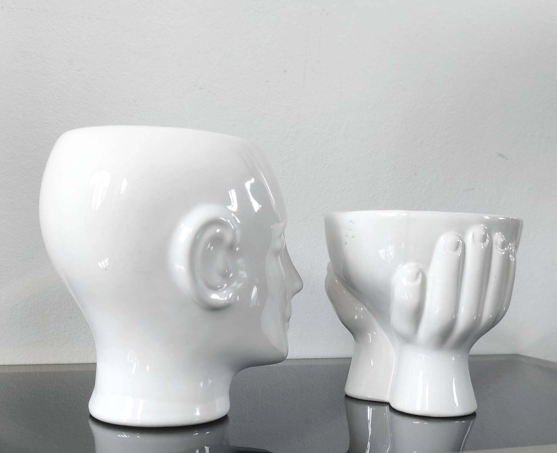 A pair of vintage ceramic plant pots.