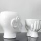 A pair of vintage ceramic plant pots.
