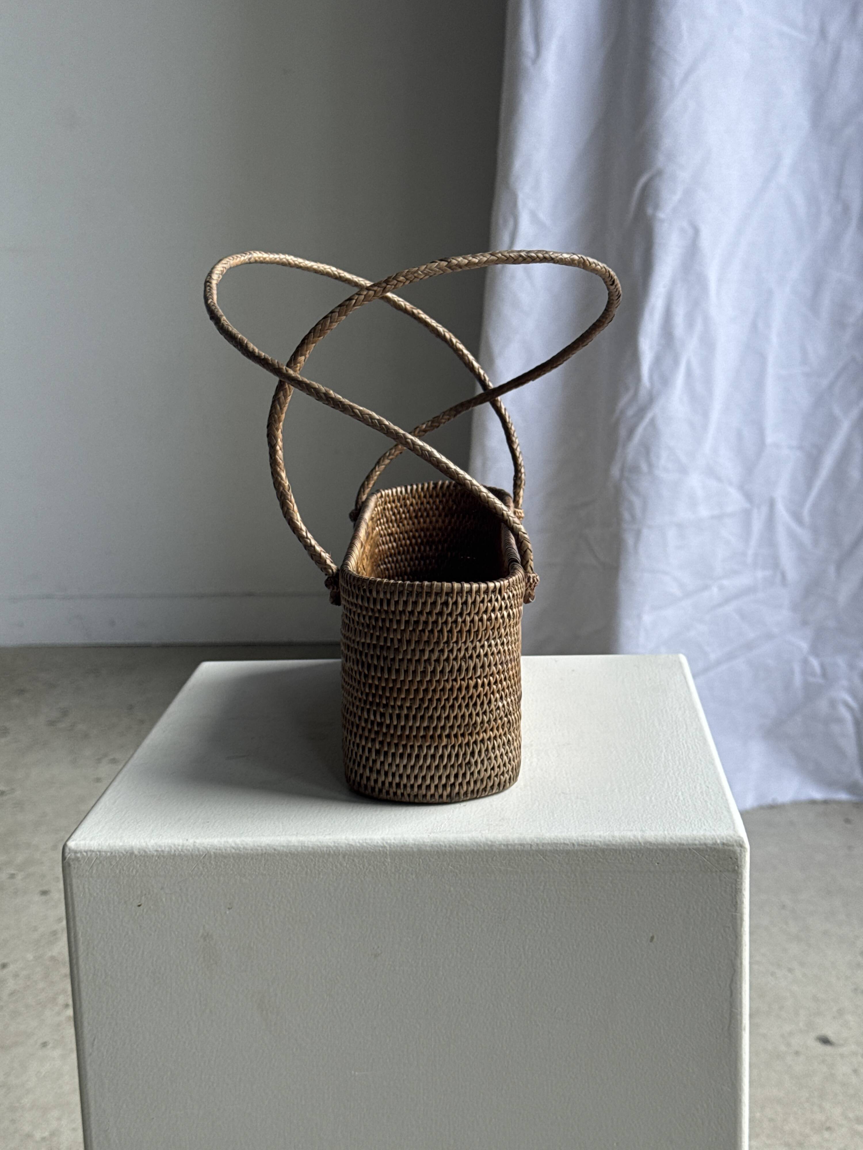 Small oval basket with long handles, traditional Indonesian L28xH10
