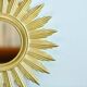Vintage gold-colored sunburst mirror