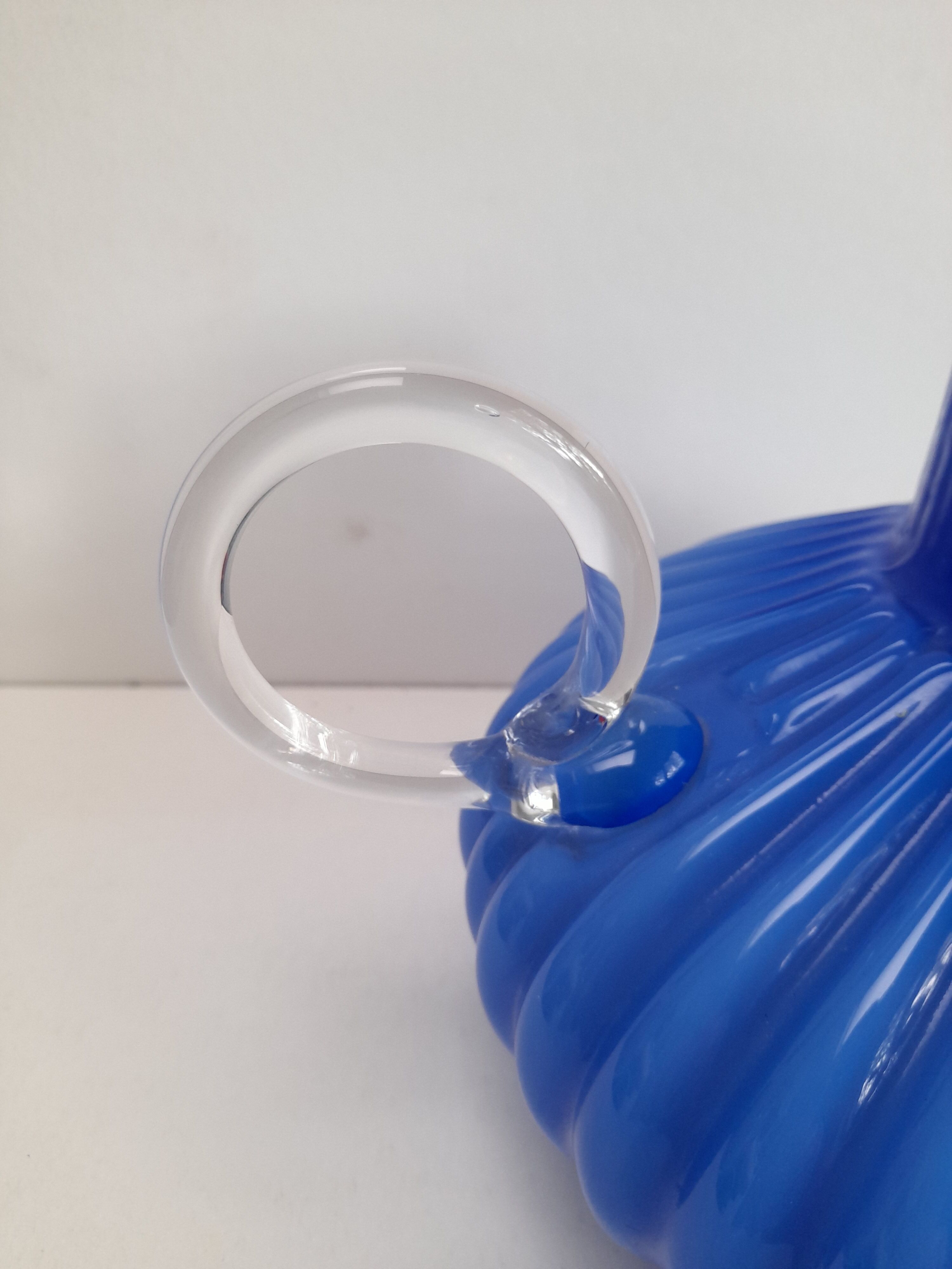 Blue opaline vase with a round handle