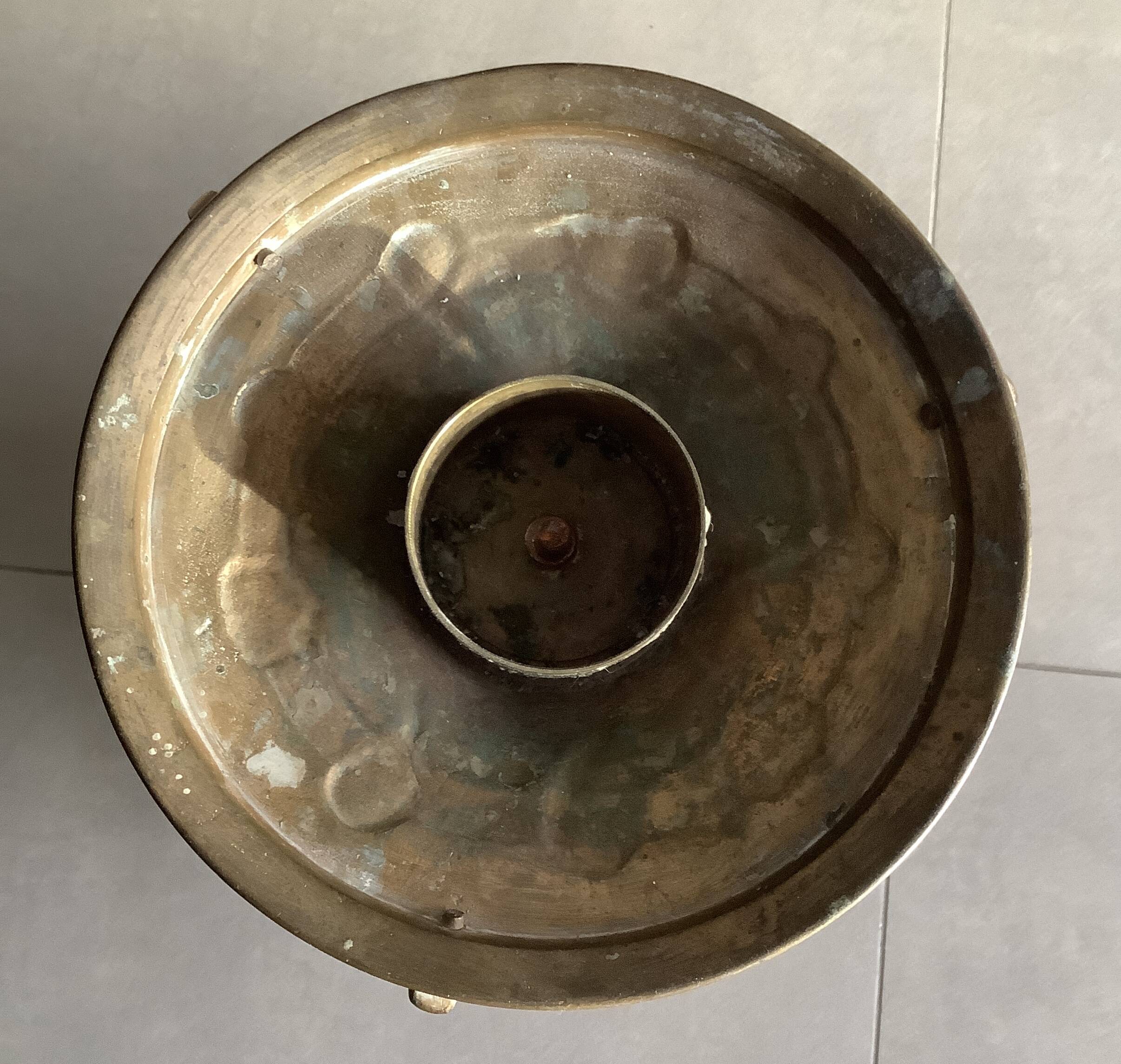 Large bronze candlestick with tripod and winged dog decoration, 19th century.