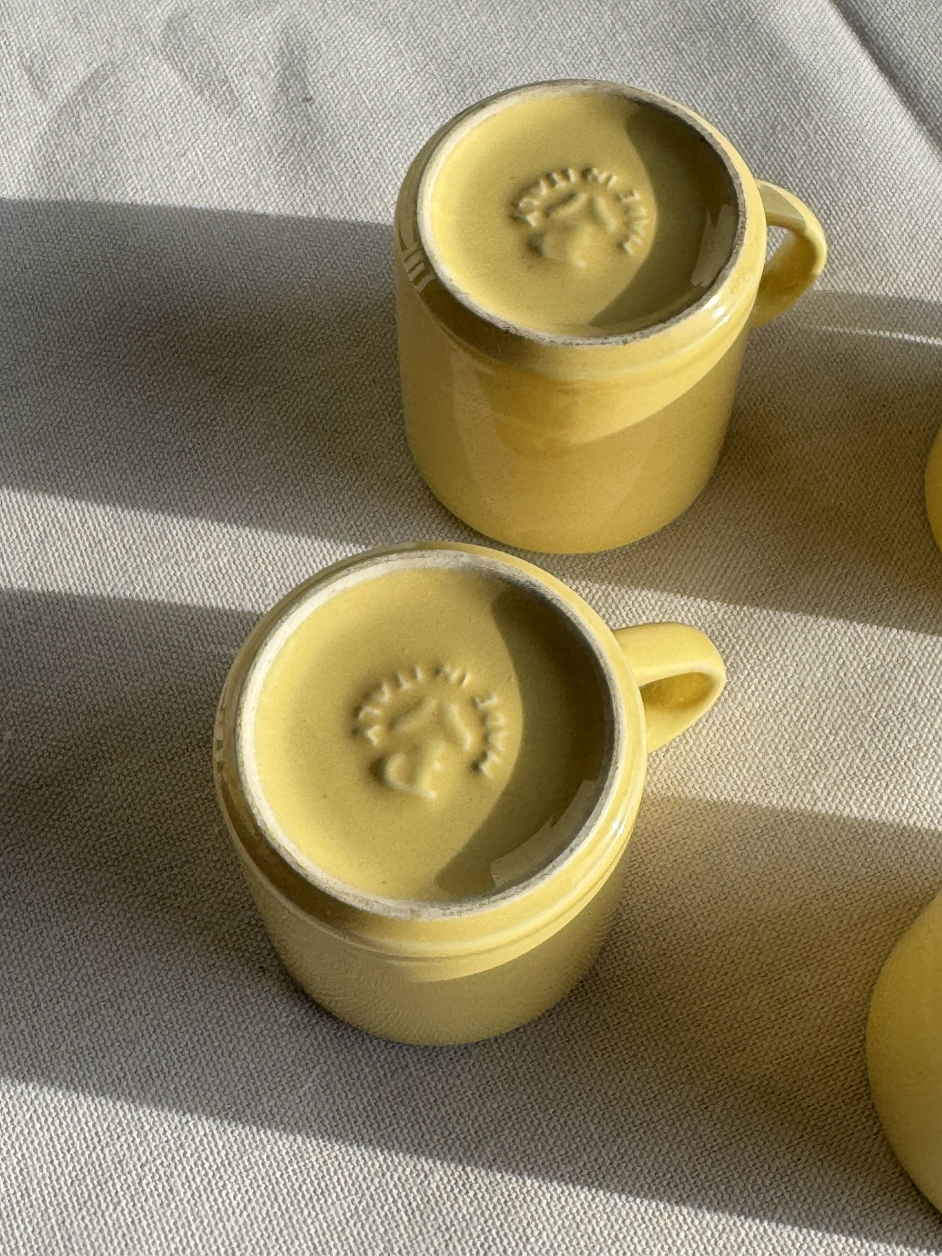 Set of 4 vintage yellow Italian espresso cups and saucers.