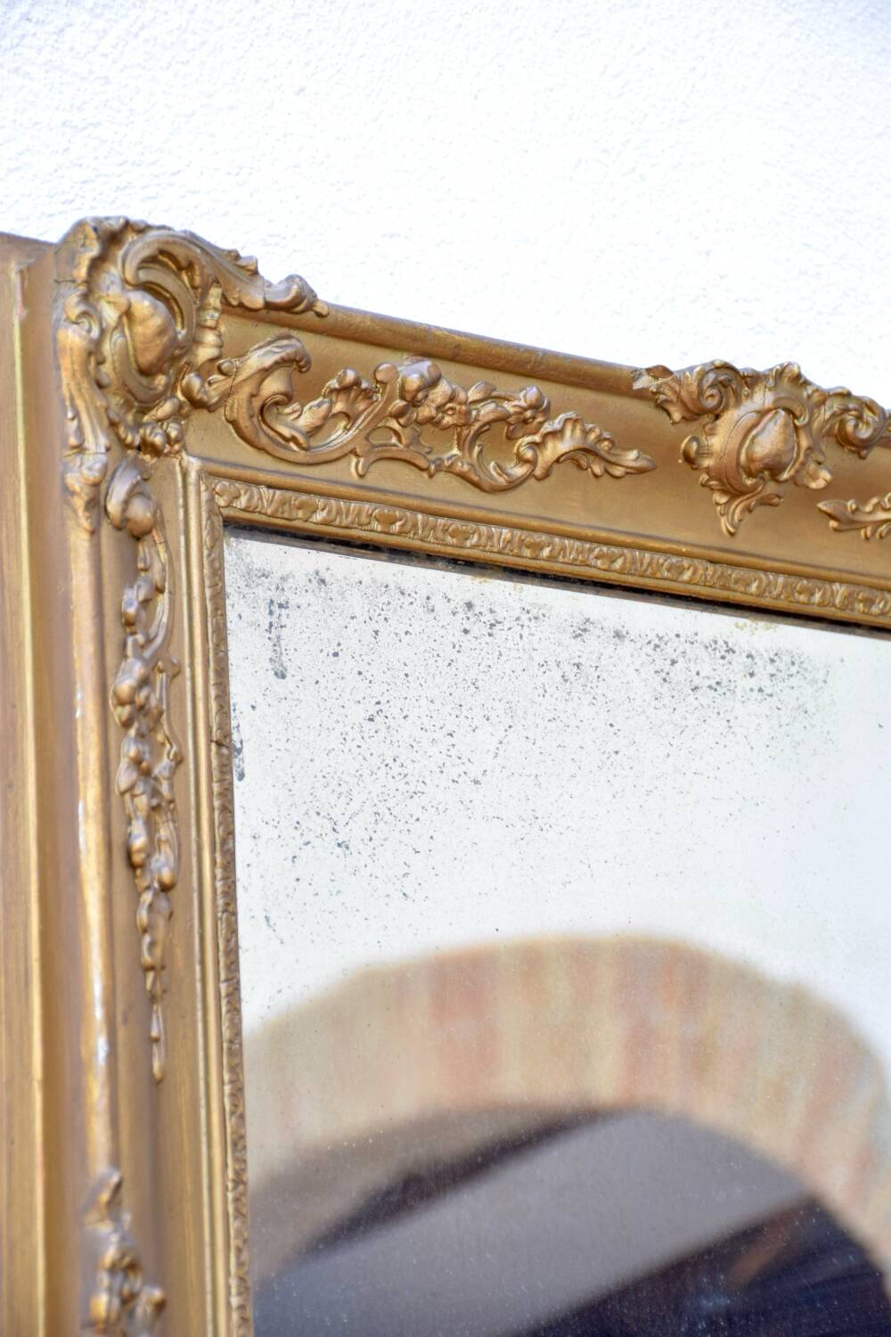 Antique mirror with gilded moldings