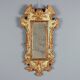Miroir en bois de mélèze sculpté et doré