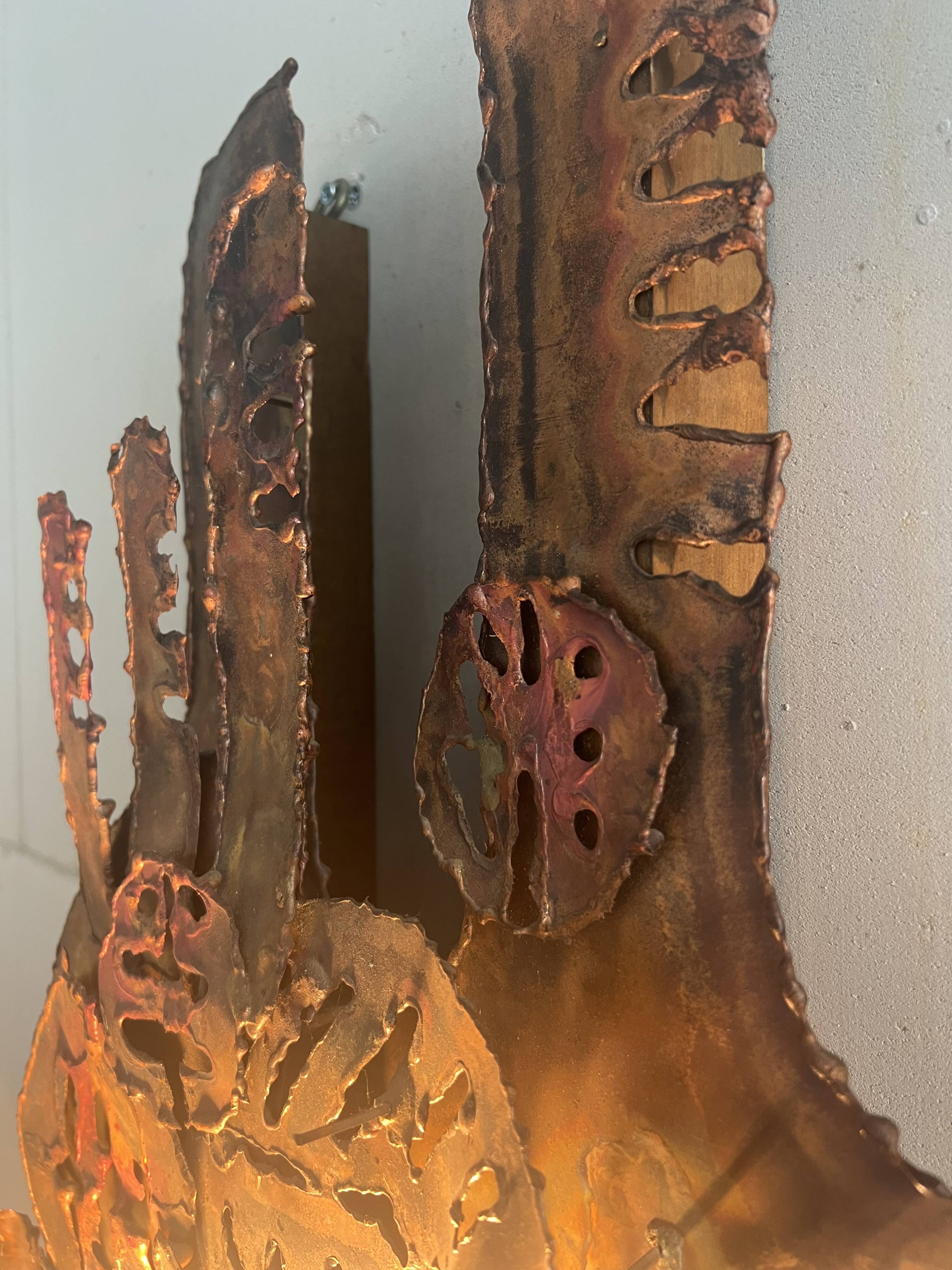 Raw expressive wall sconces by Francesco Pasinato