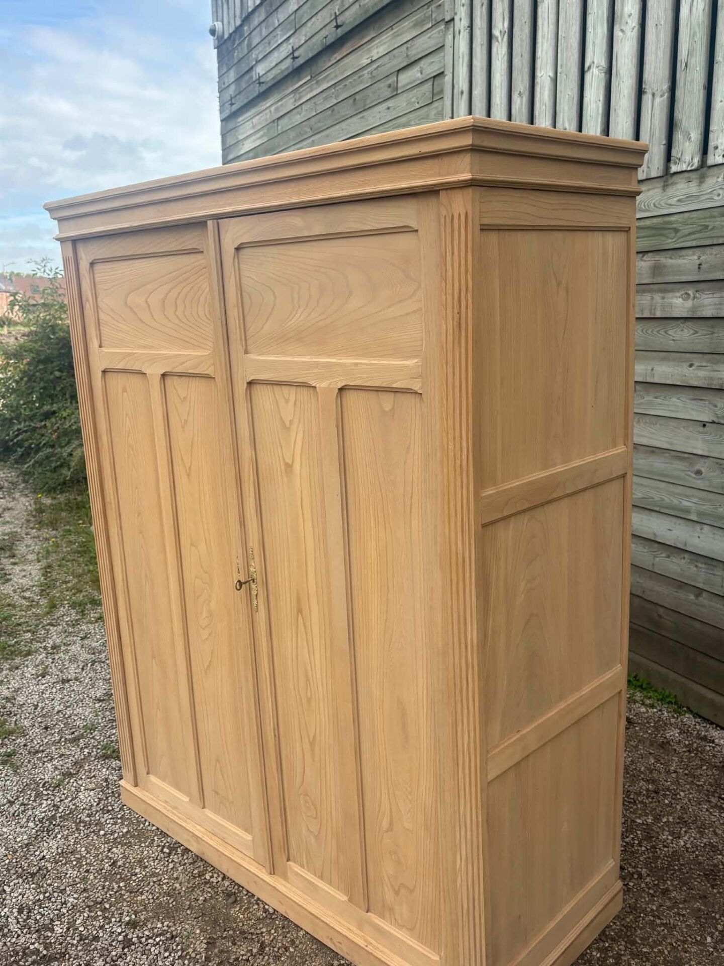 Large antique wardrobe in raw wood