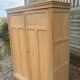Large antique wardrobe in raw wood