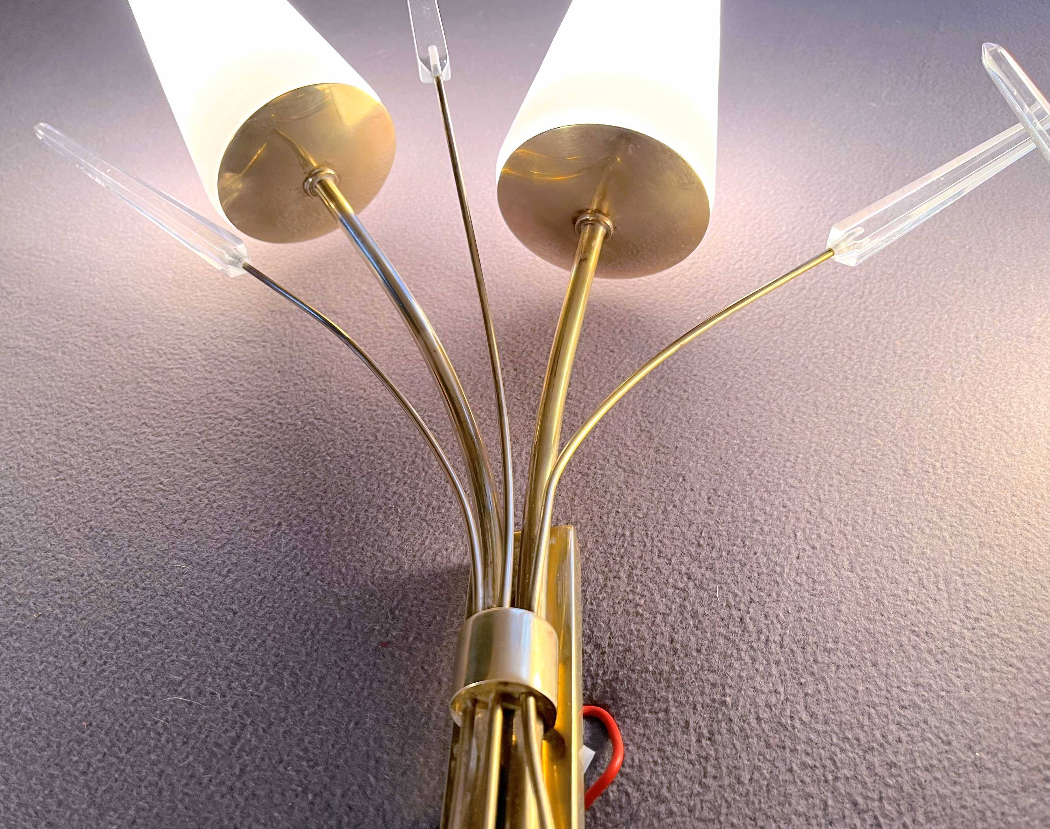Pair of mid-century modern opaline brass wall lights, Maison Lunel, France, 1950
