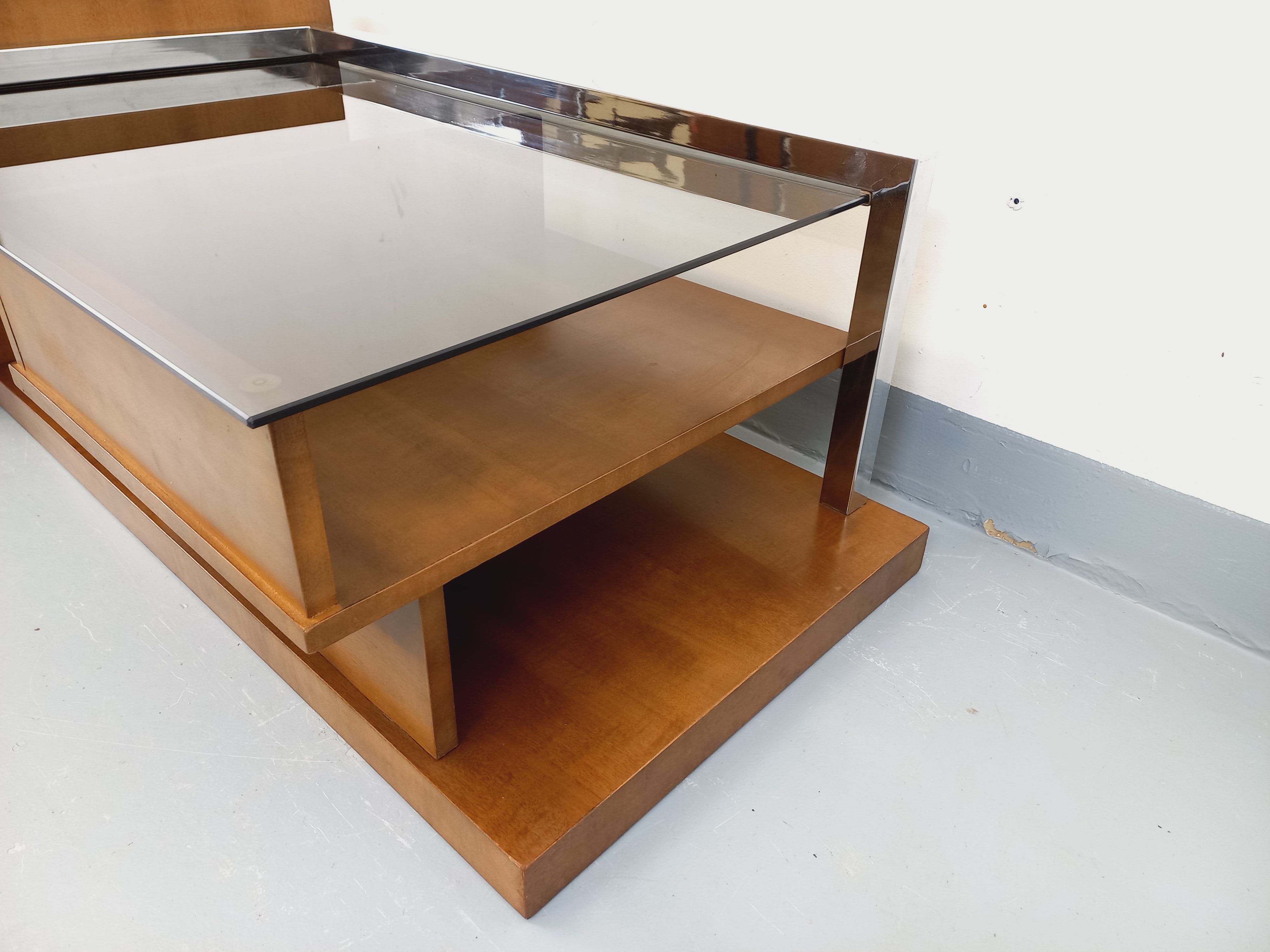 Rectangular vintage modernist coffee table with wooden niches, chrome.