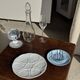 Vintage silver-plated shell butter dish with transparent bowl.