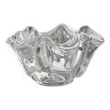 Empty pocket ashtray in transparent crystal organic shape.