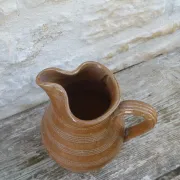 Old stoneware wine jug with patterns