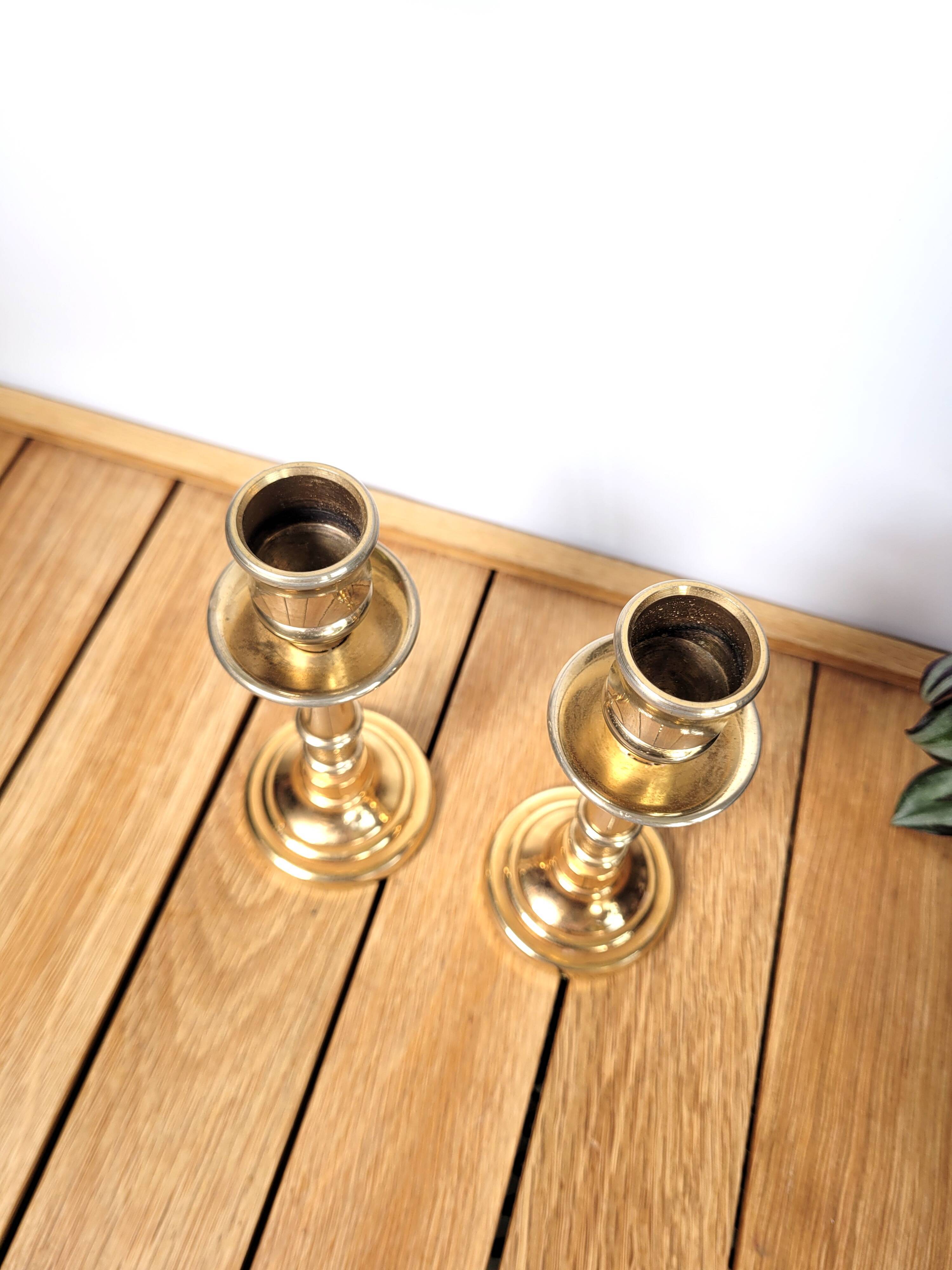 Pair of candle holders in solid gilded metal